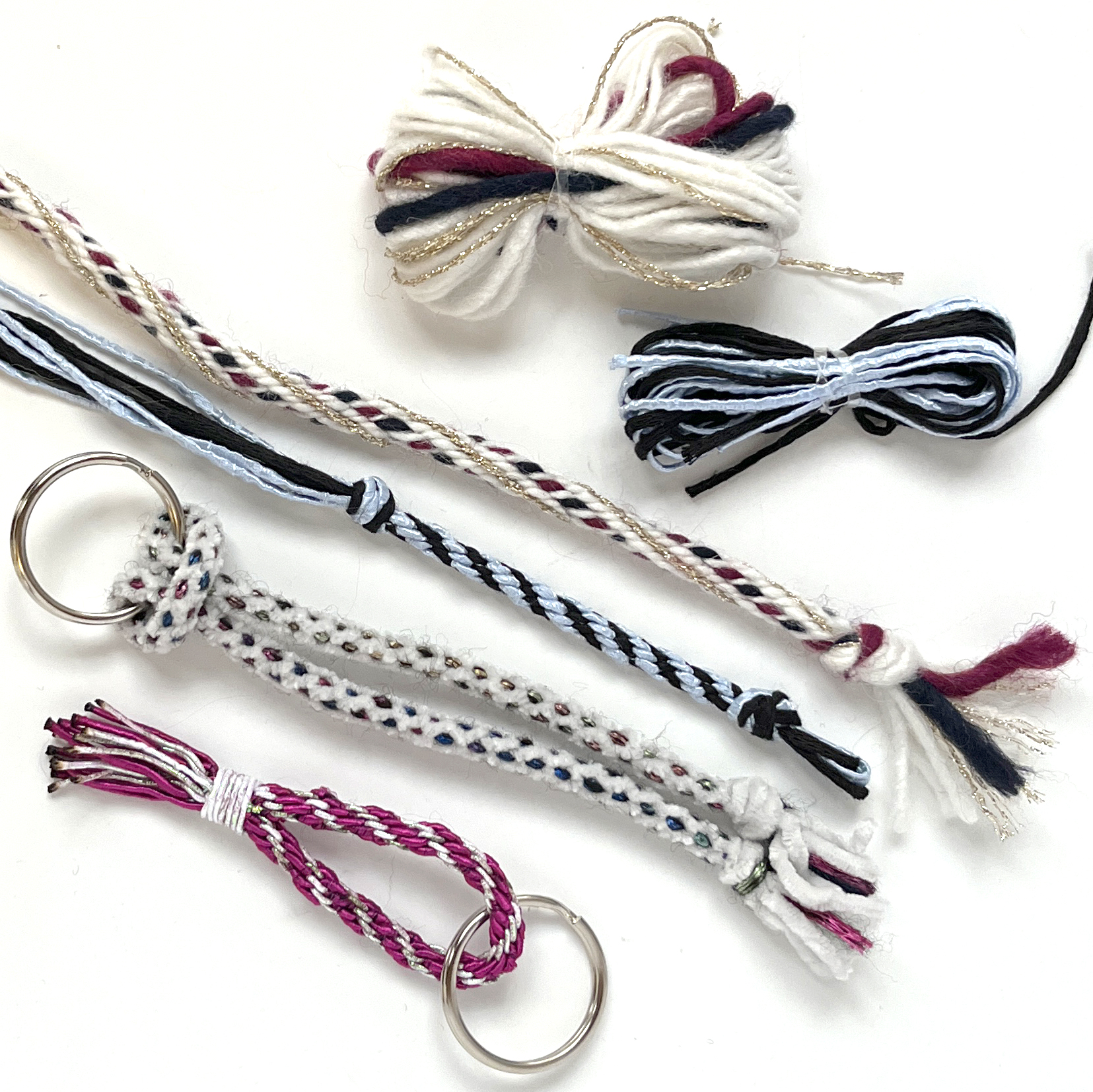 a collection of braided cords on a white background